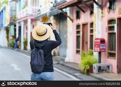 Travelers on street Phuket old town with Building Sino Portuguese architecture at Phuket Old Town area Phuket, Thailand. Travel concept