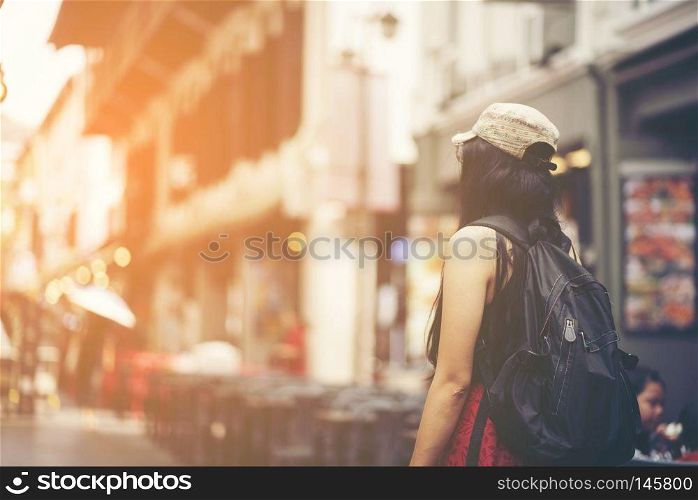 travelers women backpacker walking in China town, Singapore