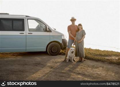 Traveling couple and their dog living in a van expecting a baby