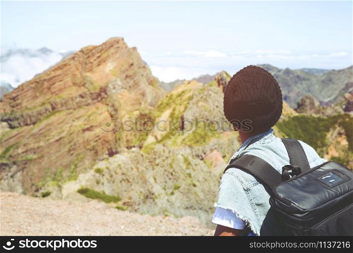 Traveling tourist hipster man Backpack looking at amazing tropical high mountains forest scenic views. Travel Camping Hiking Journey holiday Freedom concept Concept. atmospheric moment summer vacation
