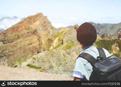 Traveling tourist hipster man Backpack looking at amazing tropical high mountains forest scenic views. Travel Camping Hiking Journey holiday Freedom concept Concept. atmospheric moment summer vacation