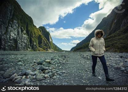 traveling woman trekking in franz josef glacier most popular touring destination in new zealand
