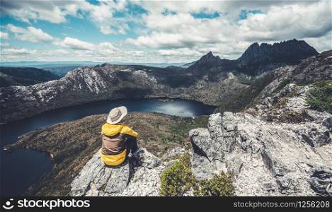 Traveller man explore landscape of Marions lookout trail in Cradle Mountain National Park in Tasmania, Australia. Summer activity and people adventure.