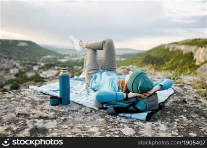traveller with beanie relaxing outdoors. Beautiful photo. traveller with beanie relaxing outdoors