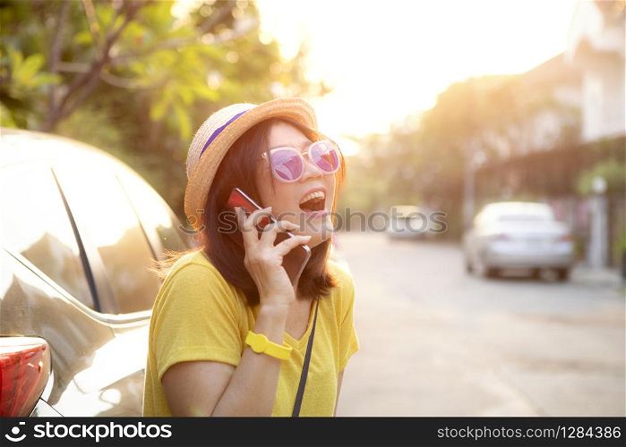 traveller woman laughing with happiness face standing on back of suv car