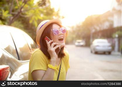 traveller woman laughing with happiness face standing on back of suv car