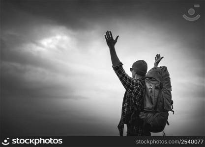 TraveMan Traveling Backpack with arms raised feeling the gratitude