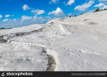 Travertine pools and terraces in Pamukkale, Turkey in a beautiful summer day