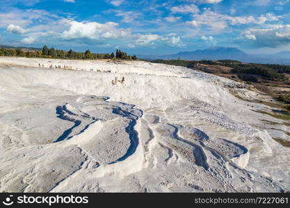 Travertine pools and terraces in Pamukkale, Turkey in a beautiful summer day