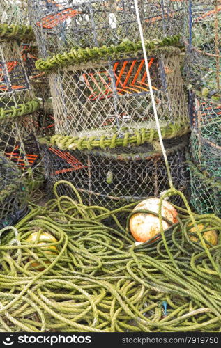 Trawler fishing nets, ropes and equipment set out on Mudeford Quay, Christchurch, Dorset, England, United Kingdom.