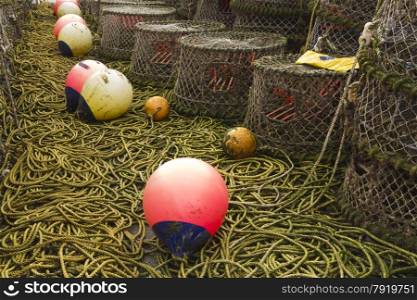 Trawler fishing nets, ropes and equipment set out on Mudeford Quay, Christchurch, Dorset, England, United Kingdom.