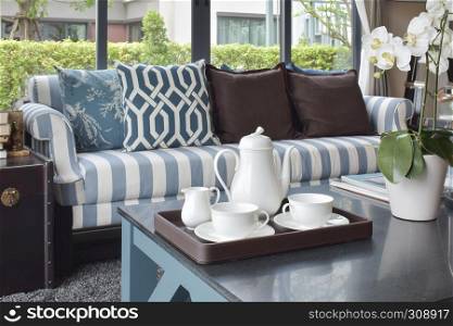 tray of tea cup and plant on black table in luxury living room at home