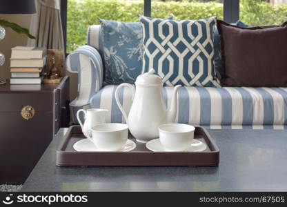 tray of tea cup on wooden table in luxury living room at home