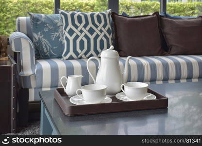 tray of tea cup on wooden table in luxury living room at home