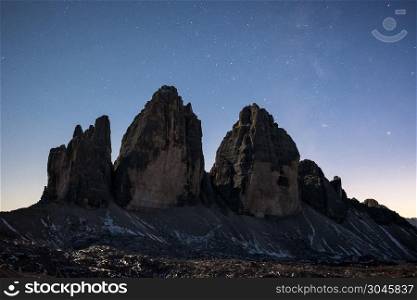 Tre Cime di Lavaredo at night over starry sky. Dolomites, Italy