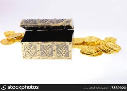 Treasure box with gold coins on a white background