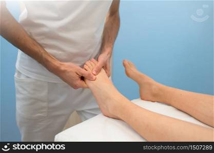 Treatment and foot massage by a professional physiotherapist.