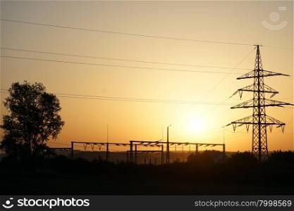 Tree and electrical station with sunset in Swabia, Germany