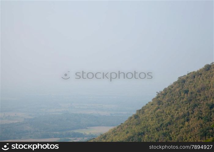 tree covered peaks. Fog in the morning. ForestCovered mountains around