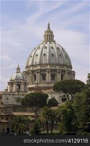 Trees in front of a church, St. Peter&acute;s Square, St. Peter&acute;s Basilica, Vatican, Rome, Italy