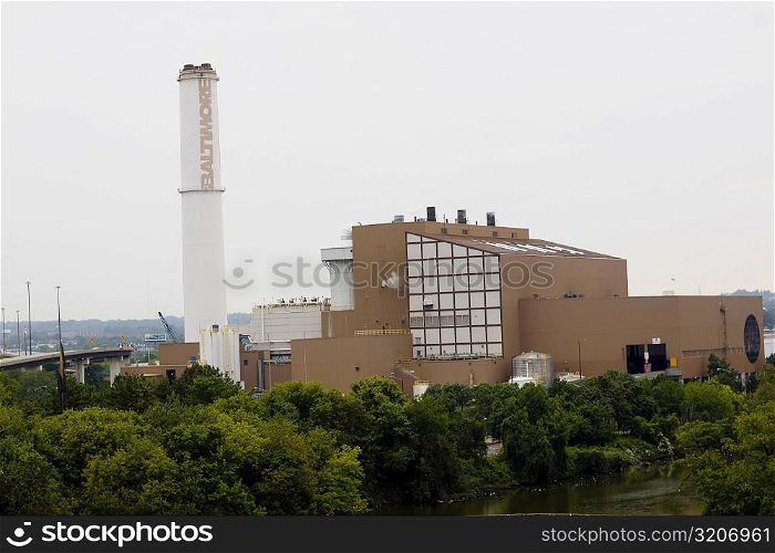 Trees in front of a factory, Baltimore, Maryland, USA