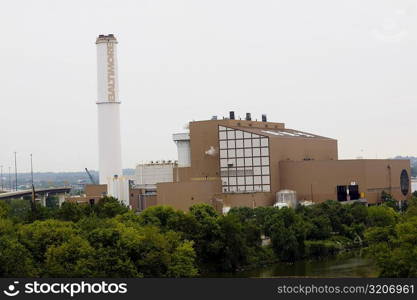 Trees in front of a factory, Baltimore, Maryland, USA