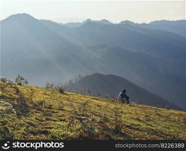 Trekker enjoying on mountain trail in tropical forest at Tak Province, Thailand.