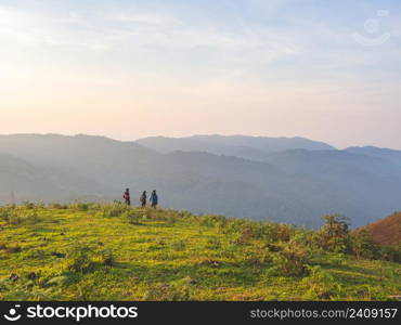 Trekking group enjoying on mountain trail in tropical forest at Tak Province, Thailand.