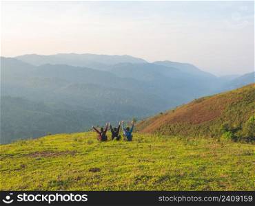 Trekking group enjoying on mountain trail in tropical forest at Tak Province, Thailand.