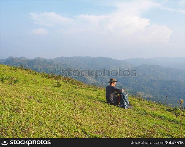 Trekking solo backpack on mountain trail in tropical forest at Tak Province, Thailand.