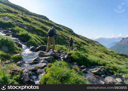 Trekking sport activity in Italian alps vacation