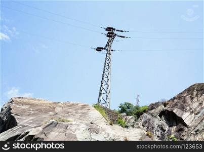 Trellis for electricity over mountain, horizontal image