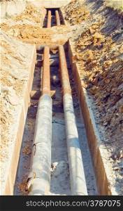 trench with old pipes heat conductor