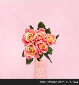Trendy banner for Valentines Day, International Womens Day or mothers day, Beautiful bouquet of pink roses in a female hand. Top view.. Beautiful bouquet of pink roses in a female hand. Top view.