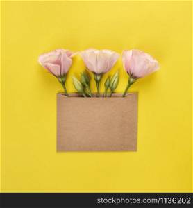 Trendy banner for Valentines Day, International Womens Day or mothers day. Party or wedding invitation. Eustoma flower arrangement with flowers and blank card, on yellow background. Eustoma flower arrangement with flowers and blank card, on yellow background