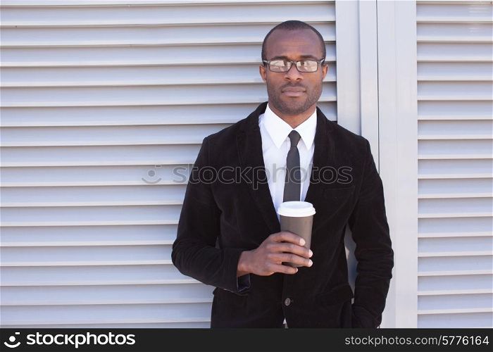 trendy black man have coffee break outdoors
