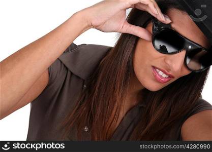 Trendy woman with sunglasses on white background