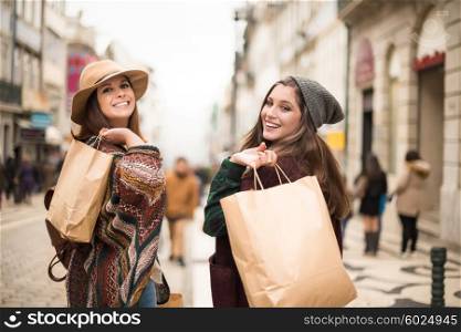 Trendy young women shopping in the city
