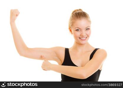 trength and power concept. Fitness woman showing fresh energy flexing biceps muscles. Girl in sportwear energetic and fun isolated