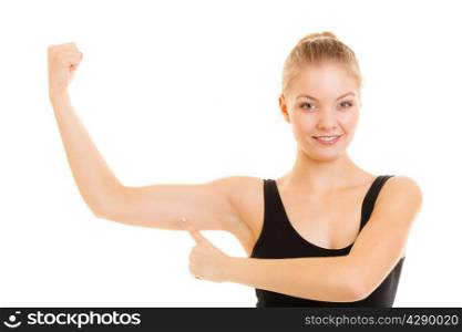 trength and power concept. Fitness woman showing fresh energy flexing biceps muscles. Girl in sportwear energetic and fun isolated