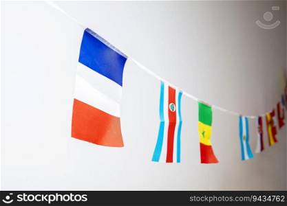 Triangle flags of various countries hanging on the rope