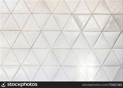 Triangle shaped ceramic tiles wall texture background