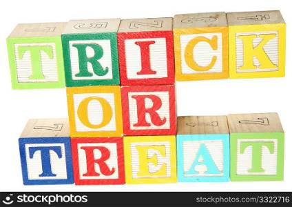 Trick or treat spelled out in alphabet blocks over white
