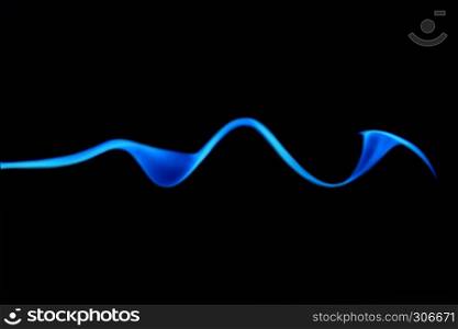 Trickle of blue smoke from the incense in the shape of a parabola on black background.. Trickle Of Blue Smoke On Black Background