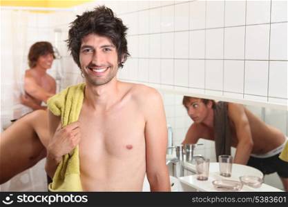 trio of male flatmates in bathroom