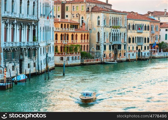 Trip boat on Grand Canal at evening in Venice, Italy