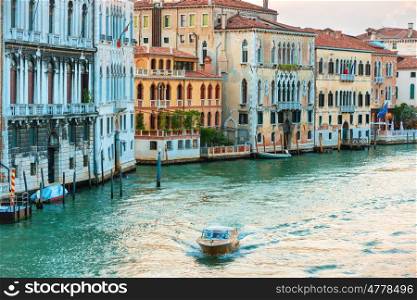 Trip boat on Grand Canal at evening in Venice, Italy