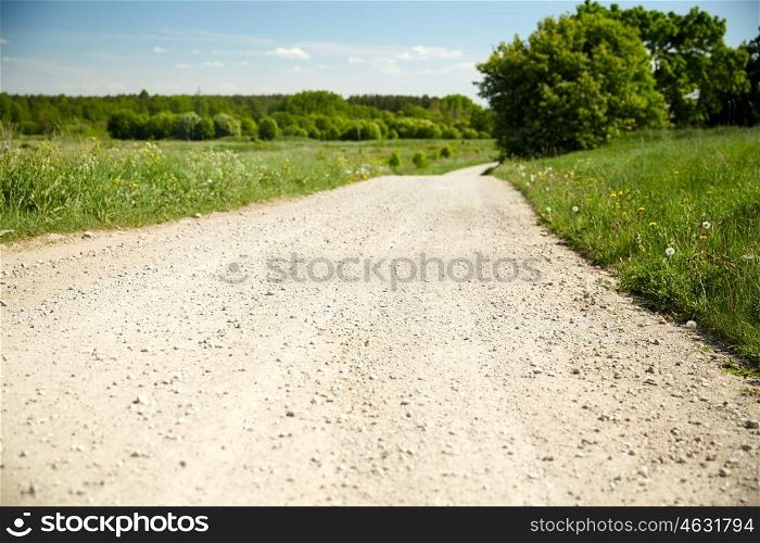 trip, travel and countryside concept - country road at summer