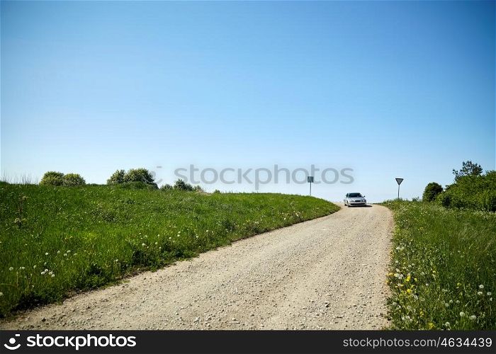 trip, travel and countryside concept - country road at summer