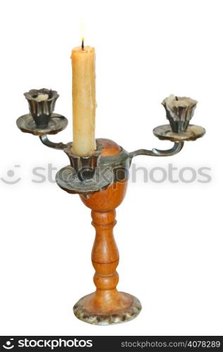 triple candlestick with one lighted candle isolated on white background